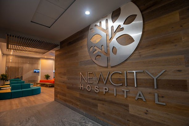 A lobby with a sign that says new city hospital.