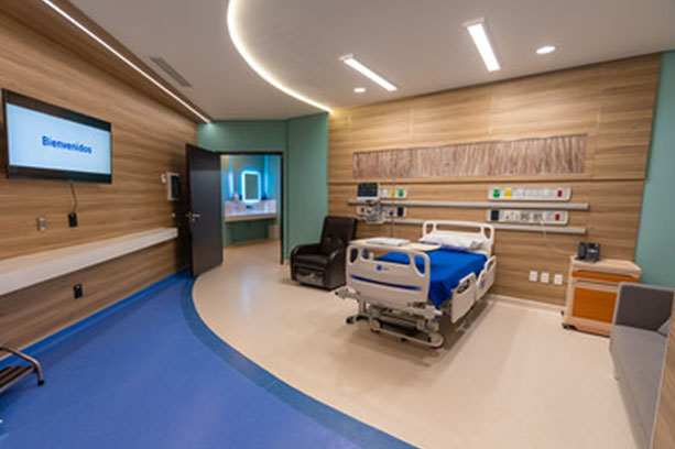 New city patient room featuring a large television