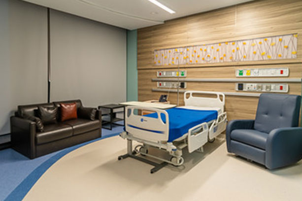 New city patient room with a comfortable sofa for a companion