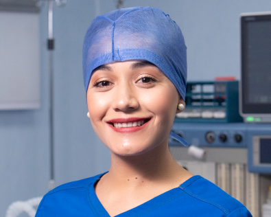 Surgeon wearing blue scrubs in the or